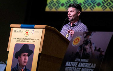 Ethan Banegas at podium during Native American Heritage Month event