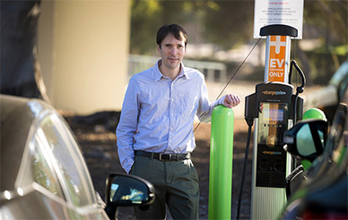 Mark Jacobsen at EV charging station